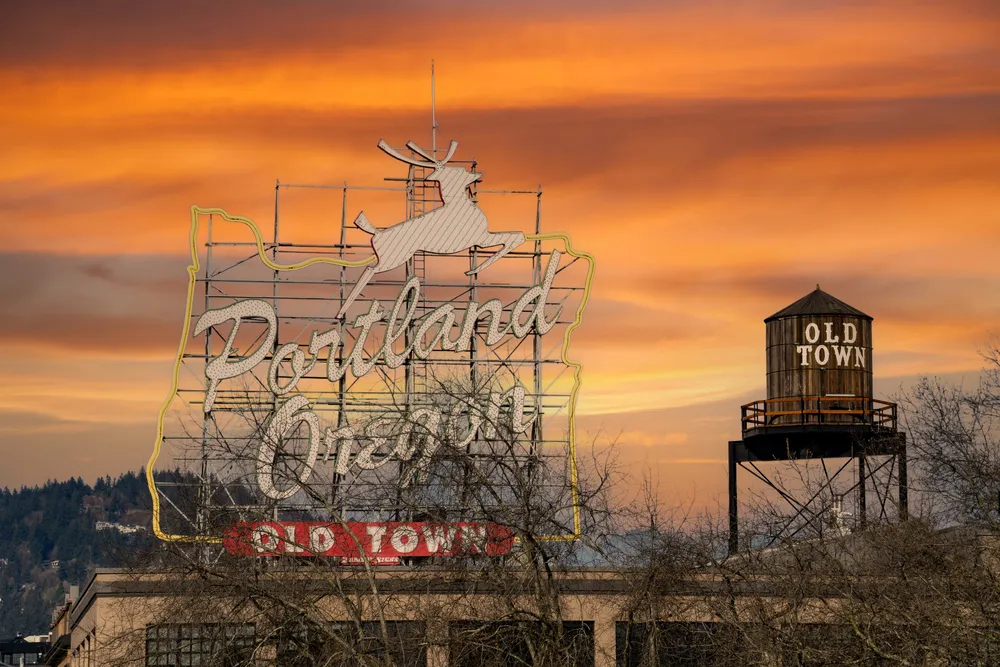 A sign featuring a silhouette of a deer, indicating wildlife presence in the area.