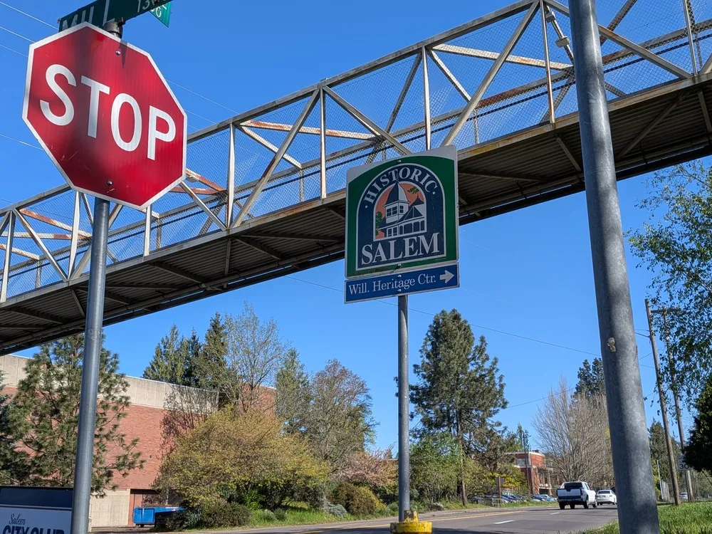 A red stop sign alongside a sign that reads "Salem," indicating a traffic stop in the city of Salem.